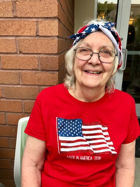 senior smiling in her 4th of july gear