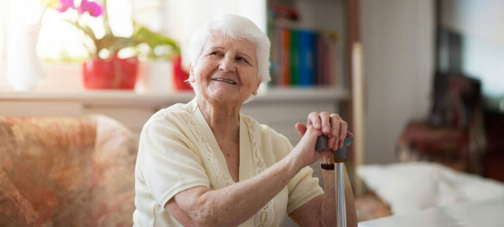 senior woman resting on her cane