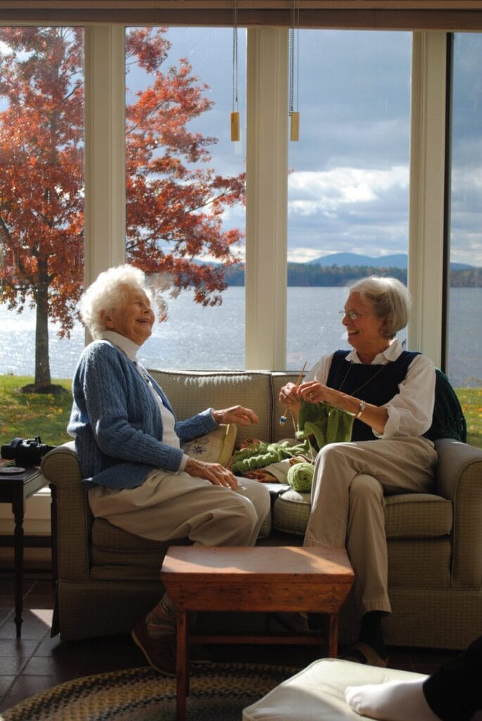Two senior women laughing
