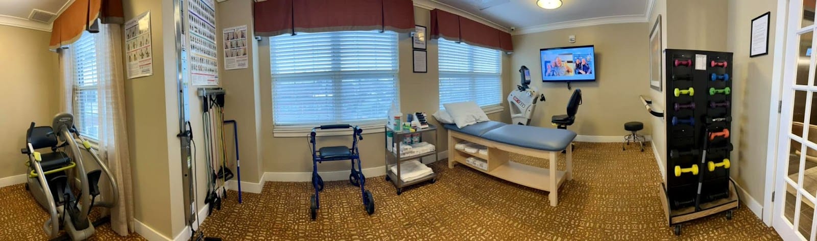 A landscape picture of the inside of a physical therapy clinic