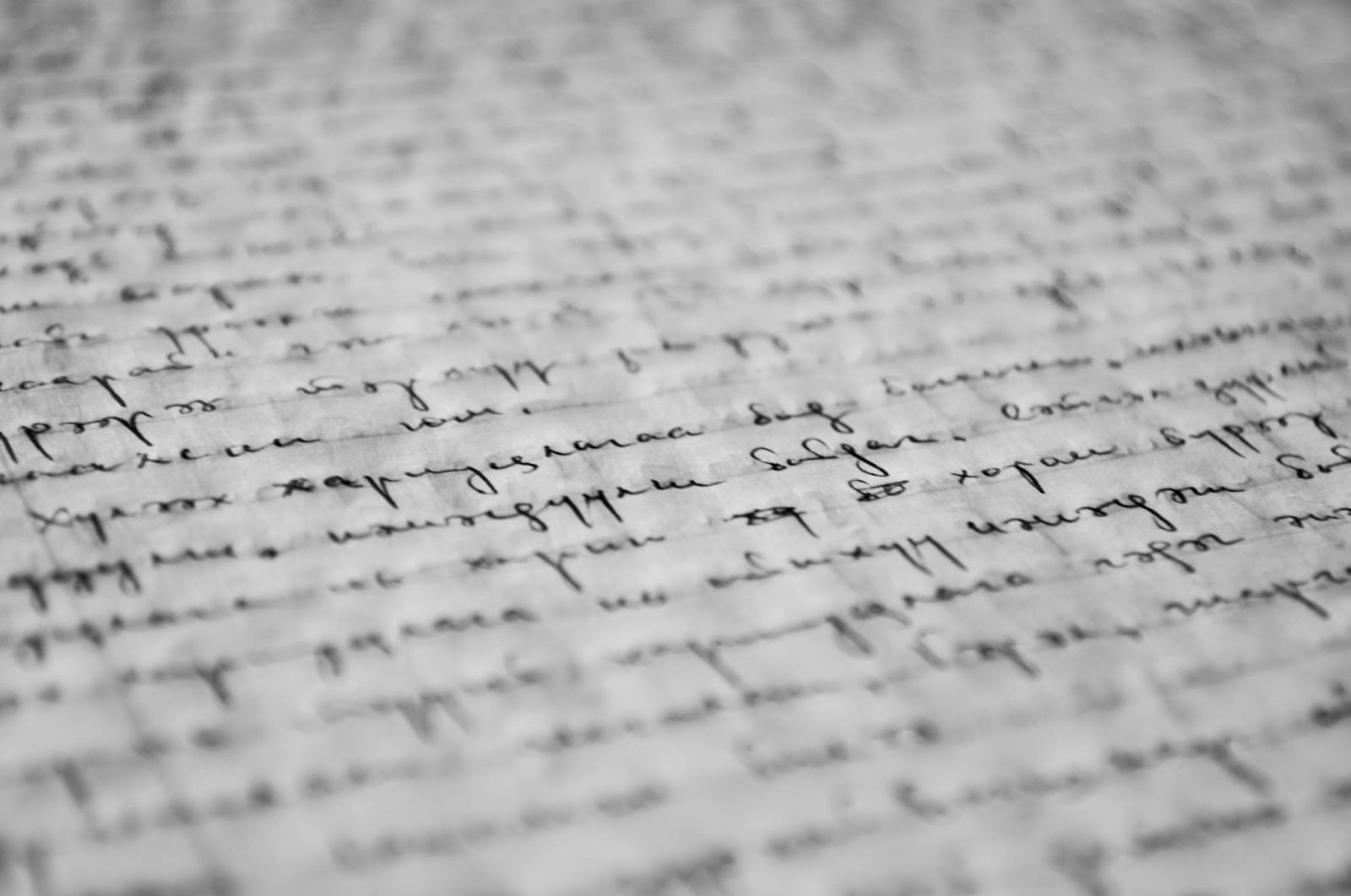 A close-up macro picture of written words on a piece of paper