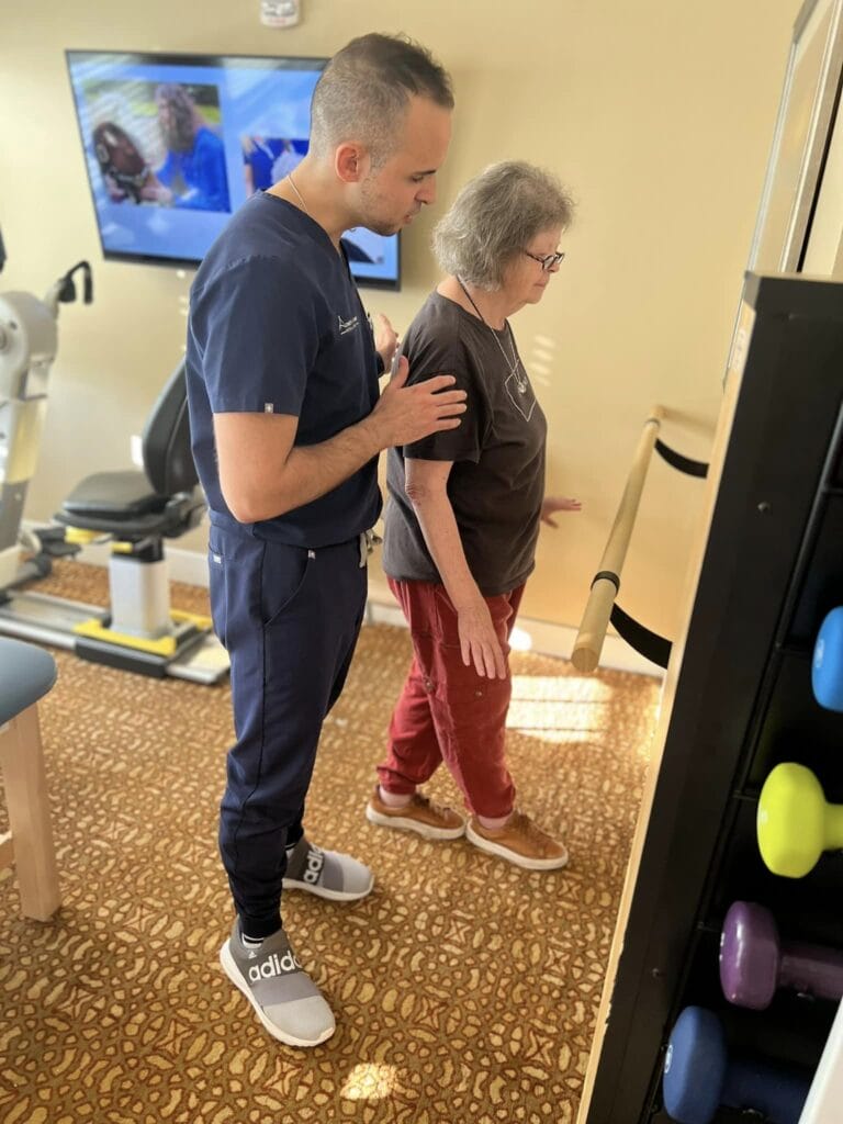 Picture of a senior walking with a physical therapist