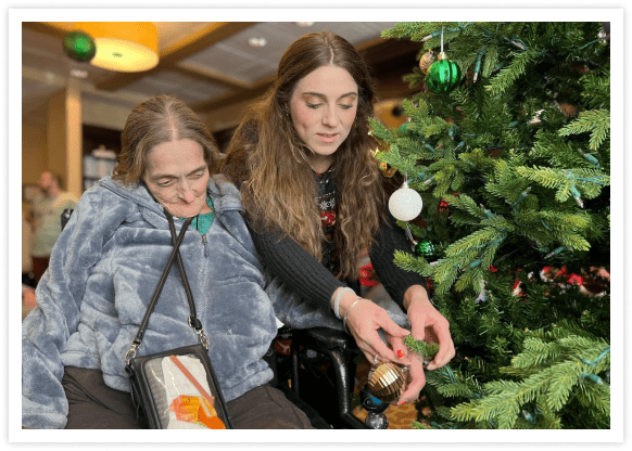 Women decorating a Christmas tree