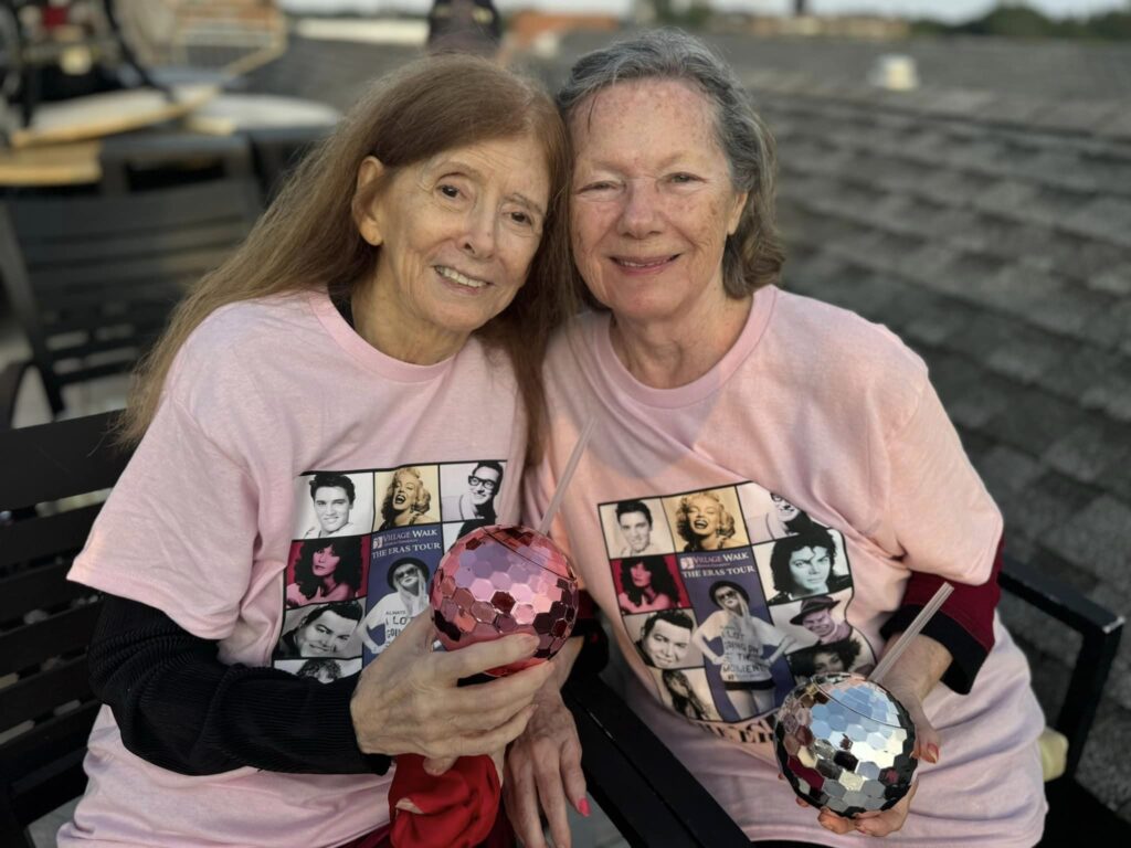 Village Walk assistant living residents with disco ball cups and 80s style t-shirts