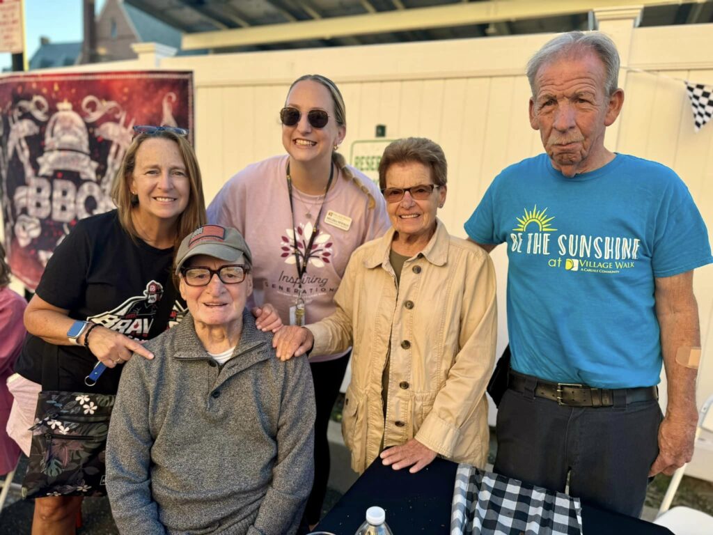 A picture of a family with an inpatient facility resident smiling