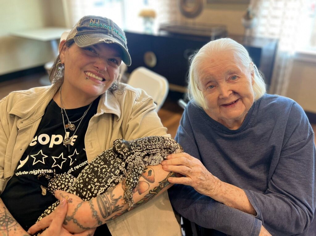 A picture of a woman under 55 in an assisted living facility with a senior