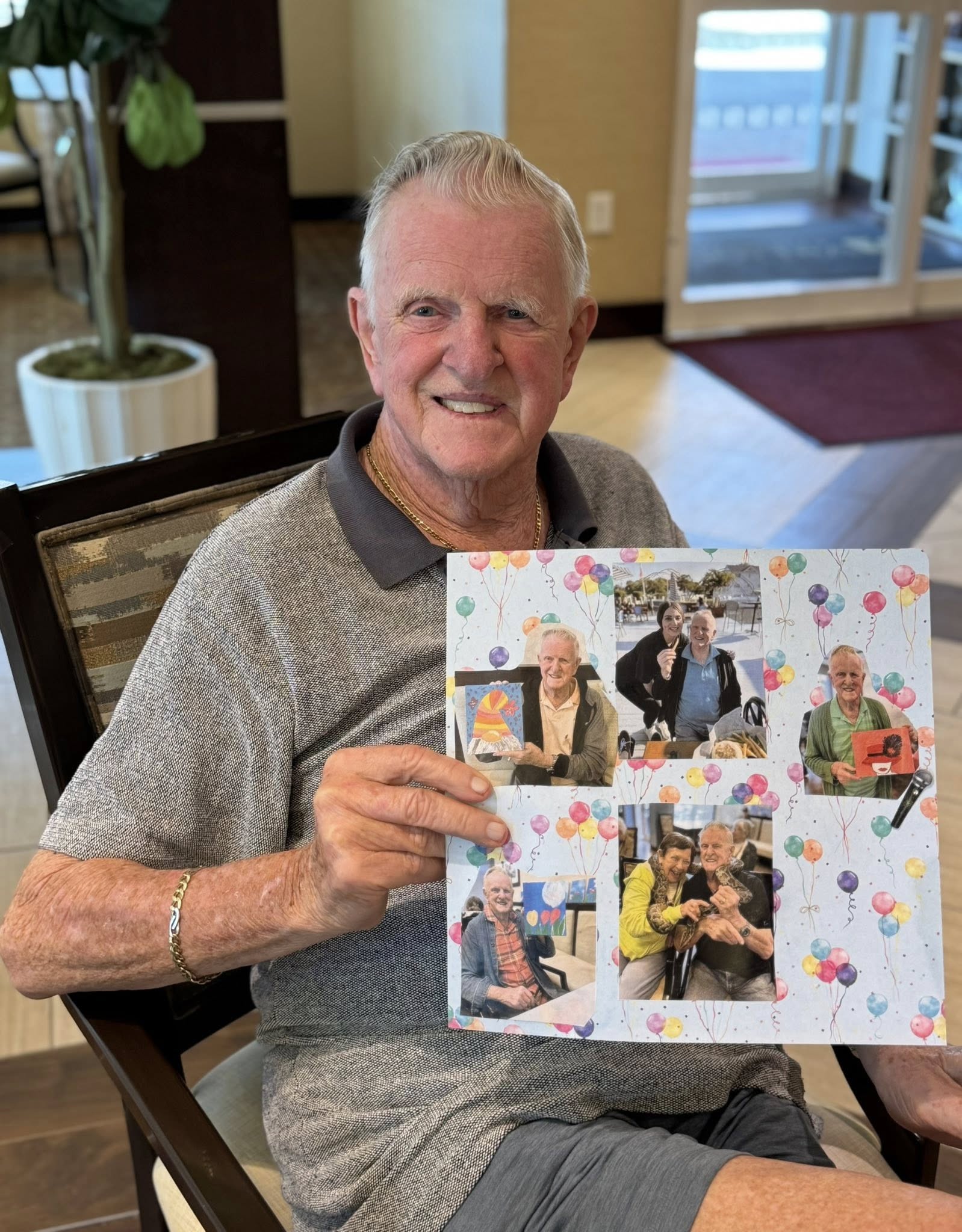 A resident in an assisted living facility holding up a collage