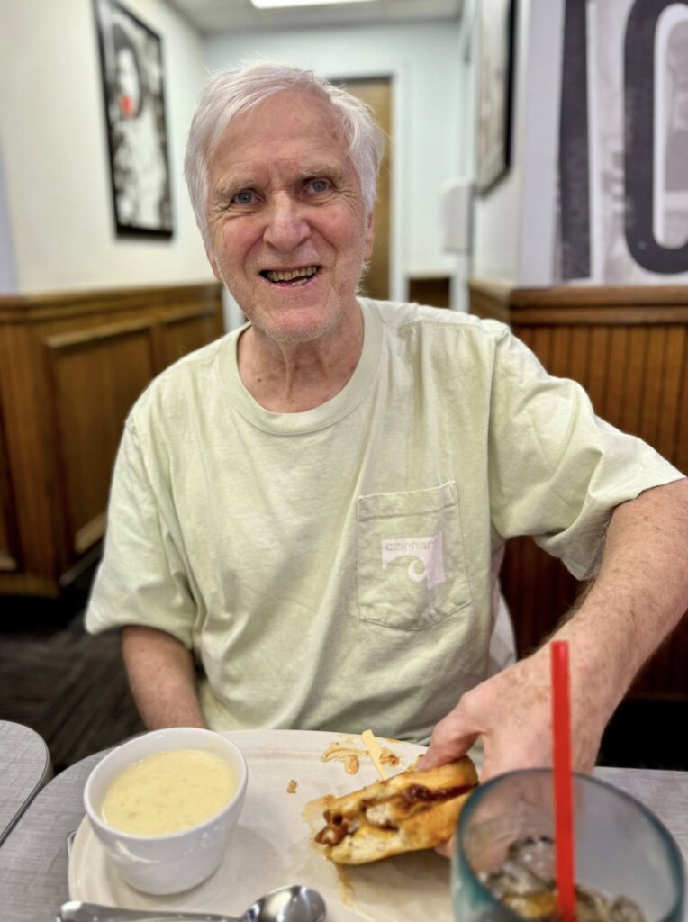 A picture of an assisted living facility resident eating breakfast